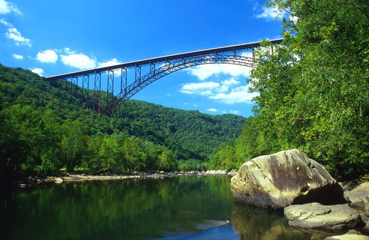 An engineering feat and regional icon, the New River Gorge Bridge connects the flourishing, green east and west banks of the river between two previously isolated communities.