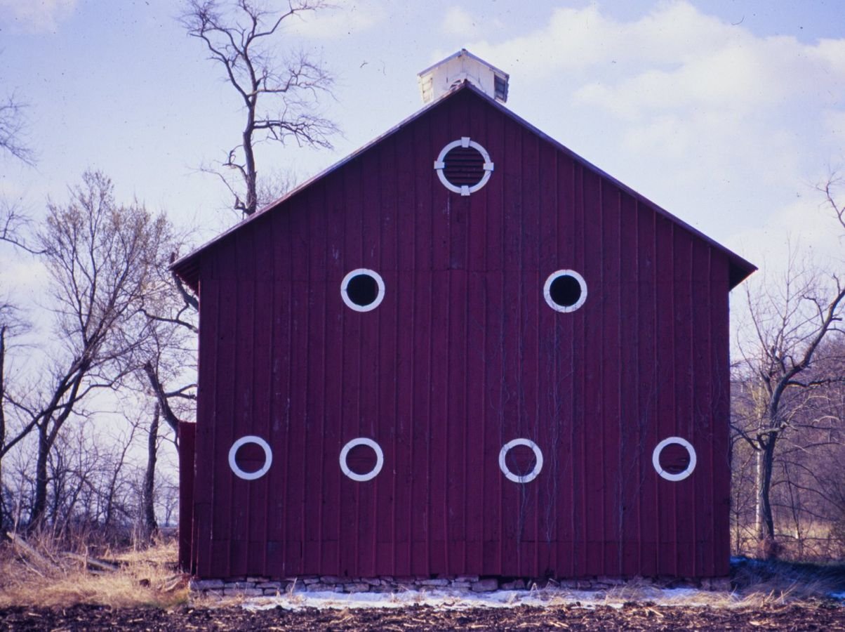 A pyramid of round windows stares from the side of this barn along the Meeting of the Great Rivers Scenic Byway.