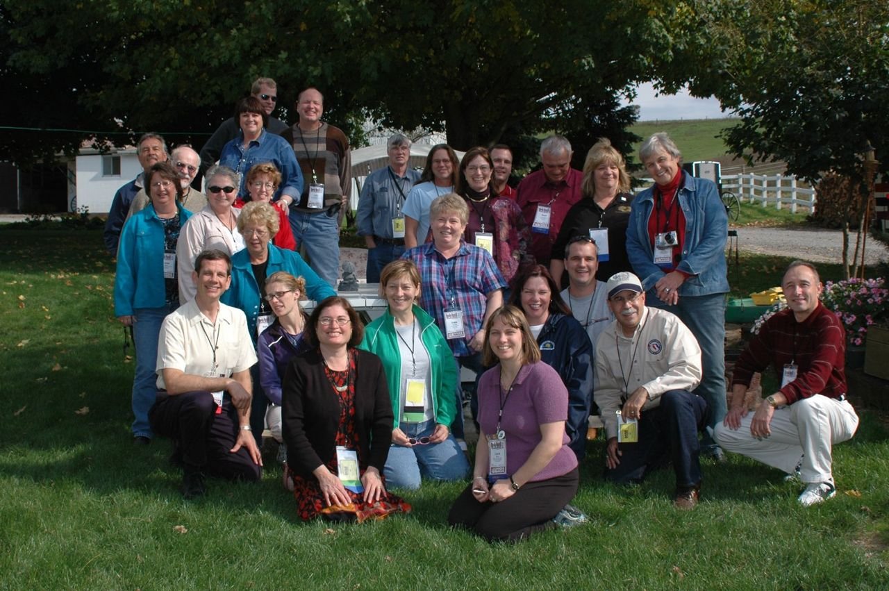 The "Authentic Experiences" workshop group from the 2005 National Scenic Byways Conference poses for a group photo at Miller's Farm on the Amish Country Byway in Ohio.