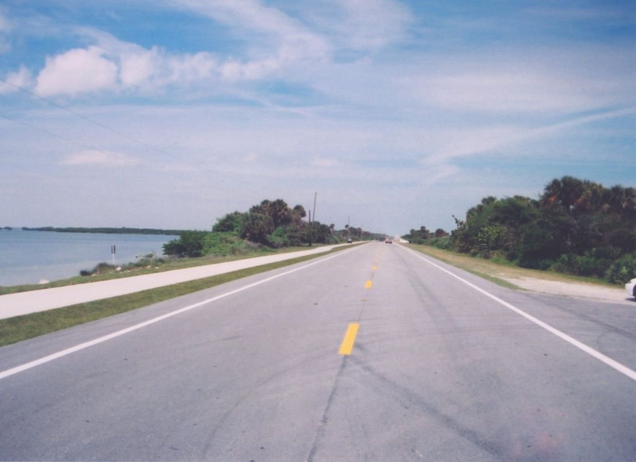 The Indian River Lagoon National Scenic Byway traverses a thin stretch of land, with the calm waters of the Indian River Lagoon to the east and the crashing breakers of the Atlantic Ocean to the west.