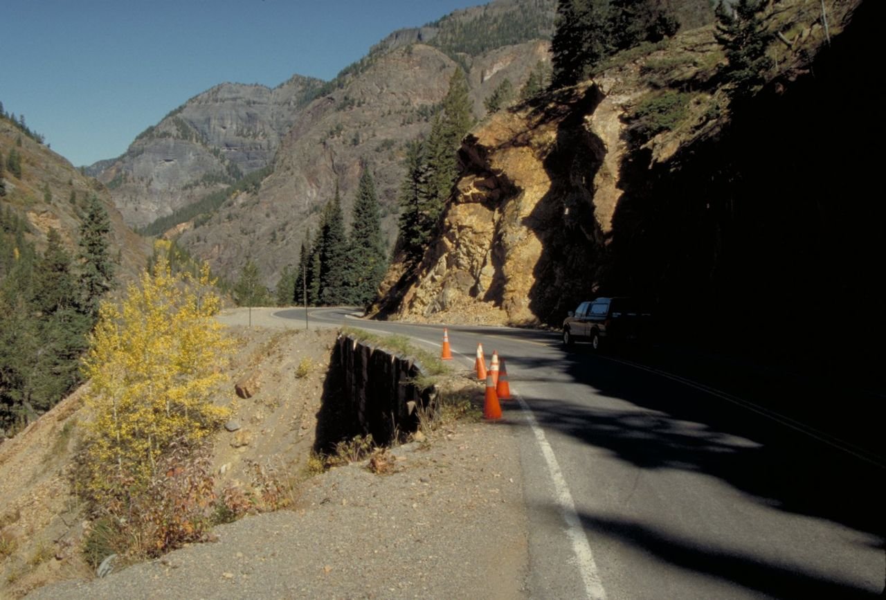 Slight road damage, marked by orange cones, makes the passage around this mountain quite narrow.