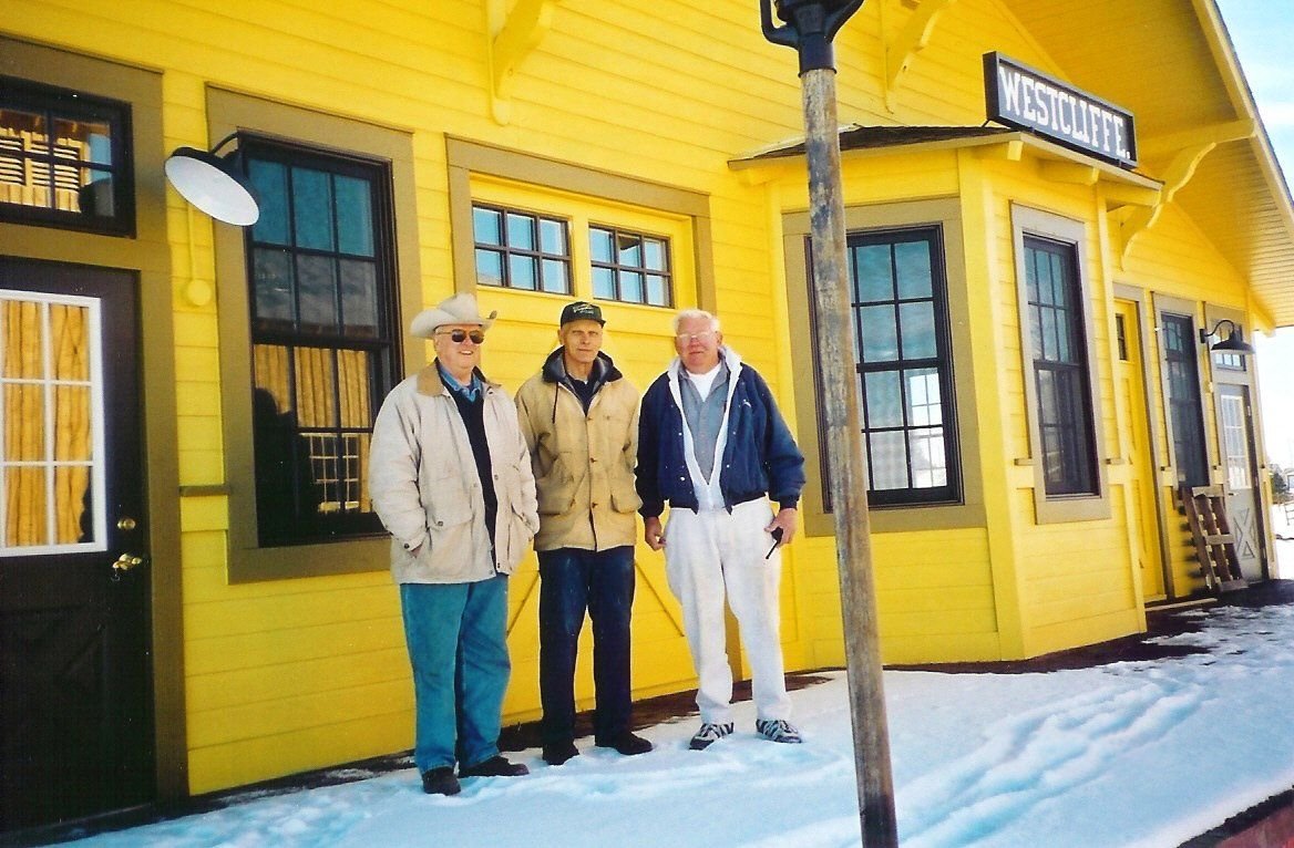 A group poses in front of the Westcliffe Information Center, which serves as a visitor and interpretive center, focusing on the Byway’s railroad history.
