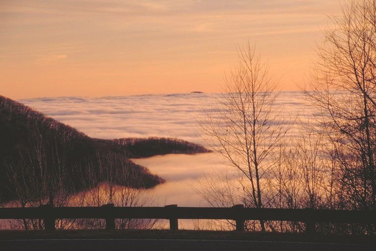 Clouds and mountains create a scenic sunset on the Cherohala Skyway near the NC/TN border.