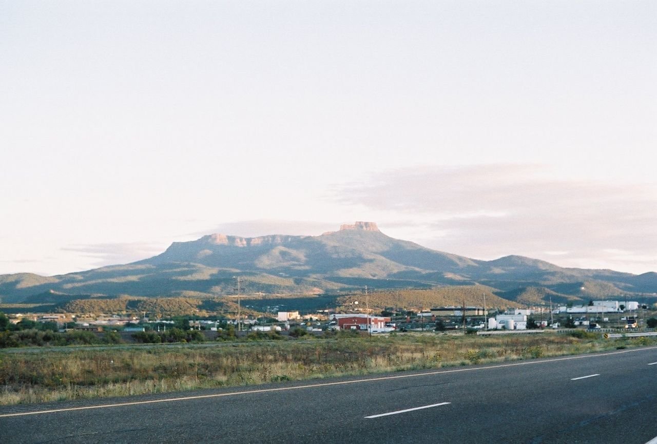 Fishers Peak can be seen from the highway as clouds haze around the mountain.