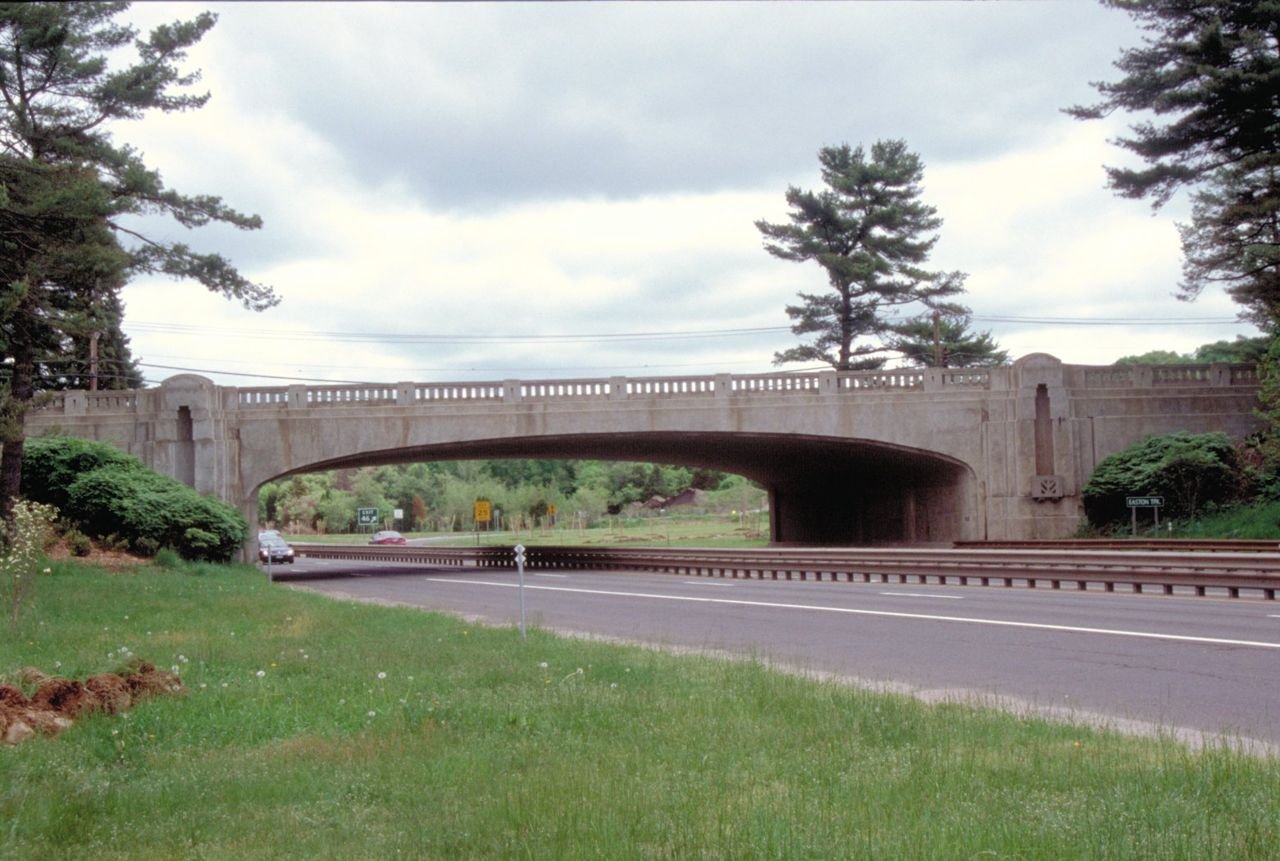 A break in traffic gives a fine view of one of the bridges on the Merritt Parkway.