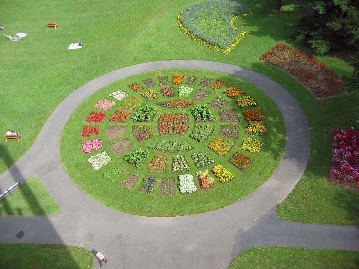 The carillon tower rises 127 feet high and sits on a commanding hillside overlooking the banks of the Potomac River and across to the monuments and skyline of Washington, DC. This photo shows the formally arranged flower garden below the Netherlands Carillon.