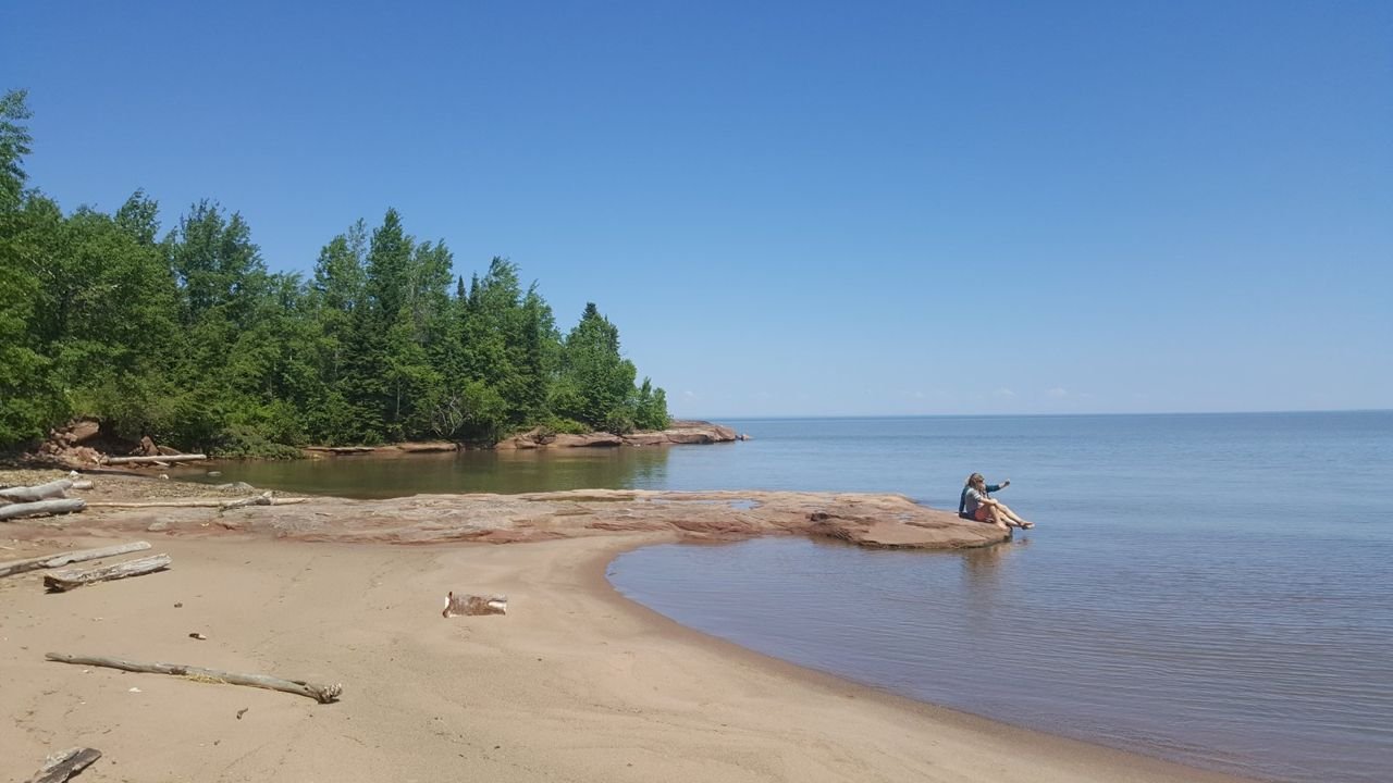 People at Quarry Beach in the Port Wing Boreal Forest.
